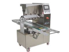 Machines for casting several layers of cream or mousse